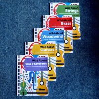 Blue carpet with a selection of music books on top of each other, including 'Wild About Strings', 'Wild About Brass', 'Wild About Woodwind', 'Wild About Guitars', and 'Wild About Piano & Keyboards'