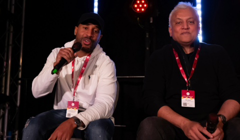 two speakers at a conference