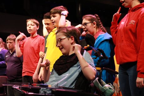 A group of young people from Y-Not Arts wearing colourful clothes