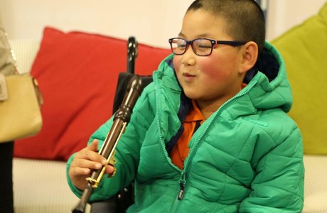 Disabled children learn on adapted musical instruments in S4E Music Service programme