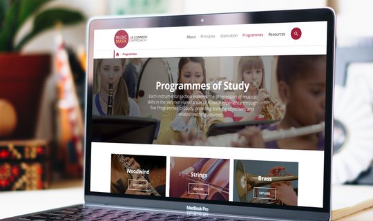 The A Common Approach website displayed on a laptop