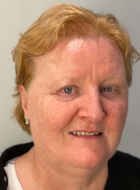 Mary Stakelum, a woman with short blonde hair, who is smiling at the camera.