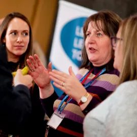 Members networking at a Music Mark event.