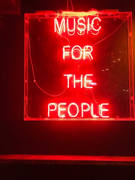 Neon sign saying 'Music for the People'